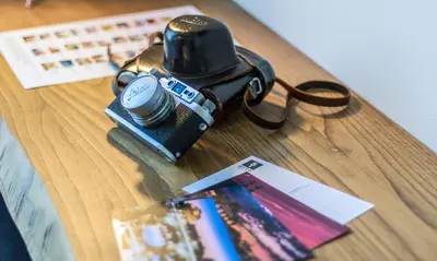 a camera sitting on top of a wooden table at OTTO Rooms & Photogallery in Rome