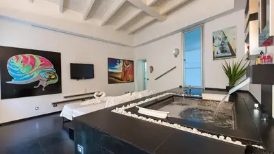 a large living room with a jacuzzi tub at Rental in Rome Cosmopolitan hi-tech in Rome