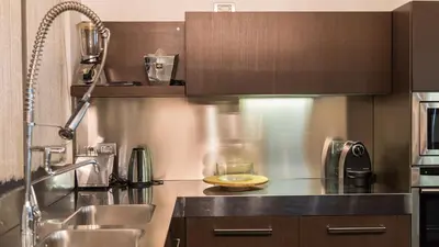 a kitchen with a counter with a bowl of food on it at Rental in Rome Cosmopolitan hi-tech in Rome