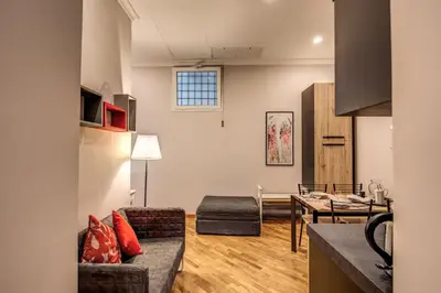 a living room with a couch and a table at Appartamento via del Pantheon in Rome