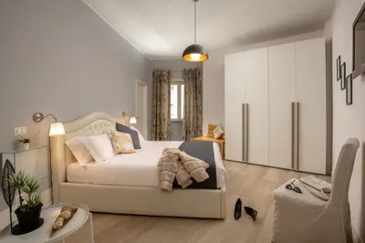 a bedroom with a white bed in a room at Vatican 84 in Rome