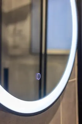 a round mirror with a circle in the middle at Nvmen Apartment con Terrazza al Colosseo in Rome