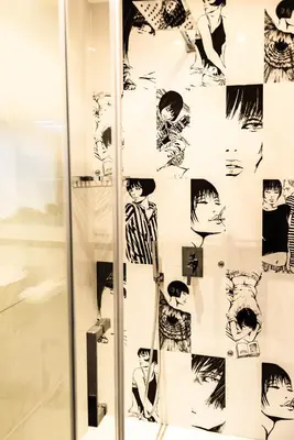 a display of drawings on a glass wall at Trevi & Pantheon Design Rooms in Rome