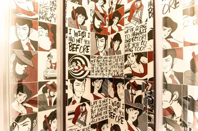 a collage of comics on a wall at Trevi & Pantheon Design Rooms in Rome