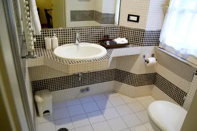 a bathroom with a sink and a toilet at Domus Mazzini in Rome