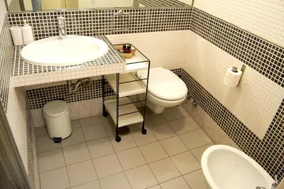 a bathroom with a sink and a toilet at Domus Mazzini in Rome