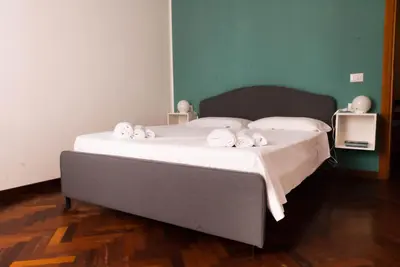 a bed with towels on it in a room at Pepe's Place - Re di Roma in Rome