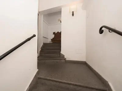 an empty hallway with stairs in a building at IG Suites in Rome