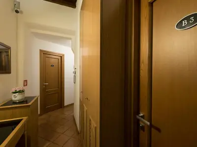 a hallway with a door leading to a bathroom at IG Suites in Rome
