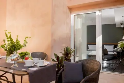 a dining room with a table and chairs at Hotel Royal Bissolati in Rome