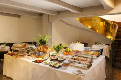 a table with a buffet of food on it at Hotel Royal Bissolati in Rome