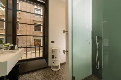 a bathroom with a sink and a window at Hotel Royal Bissolati in Rome