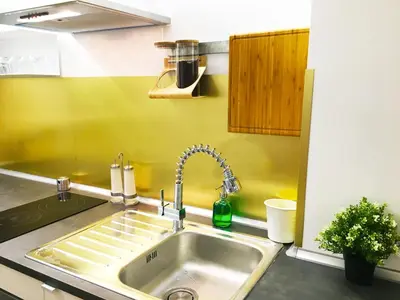 a kitchen counter with a sink and a sink at Appartamento con magnifico terrazzo vicino a Metropolitana e Vaticano in Rome