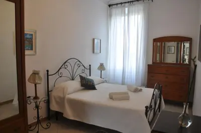 a bedroom with a bed with two towels on it at Interno 7 in Rome