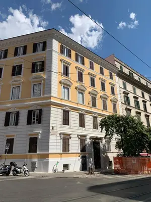 a large building on the corner of a street at In the Center by Local Domus in Rome