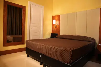 a bedroom with a bed and a mirror at Federica's Home in Rome