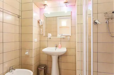 a bathroom with a sink and a mirror at Vatican Town in Rome