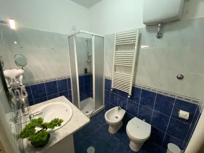a bathroom with a sink and a toilet and a shower at Domus Prati in Rome