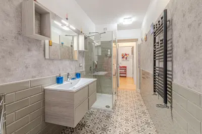 a bathroom with a sink and a shower at Casa Fabio in Rome