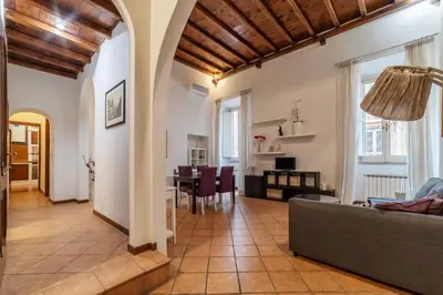 a living room with a couch and a table at GuestHost - Pantheon Charming Apartment in Rome