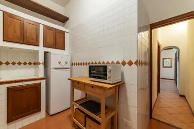 a kitchen with a counter with a microwave on it at GuestHost - Pantheon Charming Apartment in Rome