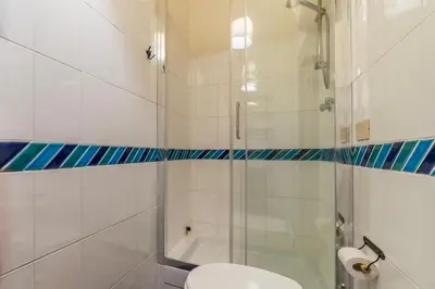a bathroom with a shower and a toilet and a tub at GuestHost - Pantheon Charming Apartment in Rome