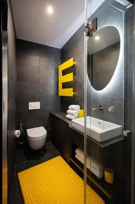 a bathroom with a sink and a mirror at Tolli Colosseo Apartment in Rome