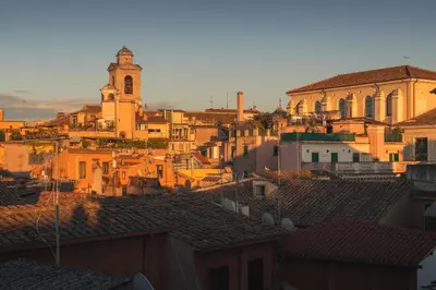 a view of a city with a clock tower and roofs at Relais Orso in Rome