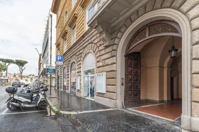 a motorcycle parked on a sidewalk next to a building at Be My Guest in Rome