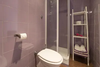 a small bathroom with a toilet and a shower at Be My Guest in Rome