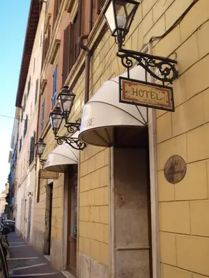 a hotel sign on the side of a building at Hotel Trastevere in Rome