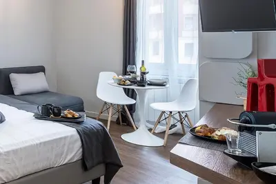 a room with a bed and a table with plates of food at Z-ArchSuites in Rome
