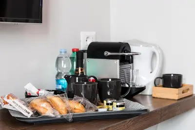 a tray with bread and croissants on a counter at Z-ArchSuites in Rome