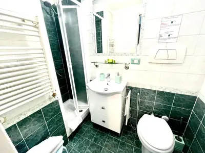 a bathroom with a toilet and a sink at Rhome86 in Rome