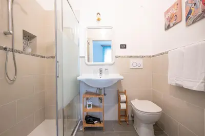 a bathroom with a sink and a toilet at Hotel Ascot in Rome