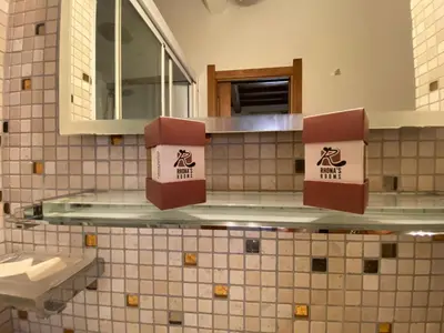 a bathroom with a counter with two boxes on it at Condotti Rooms in Rome