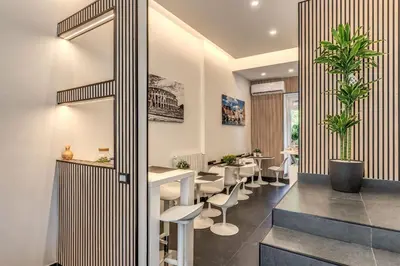 a dining room with a table and chairs at Imperia Suite in Rome