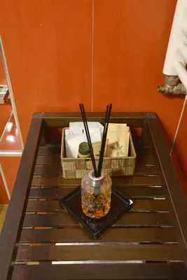 a vase sitting on a table with chopsticks on it at St. Peter' Six Rooms & Suites in Rome