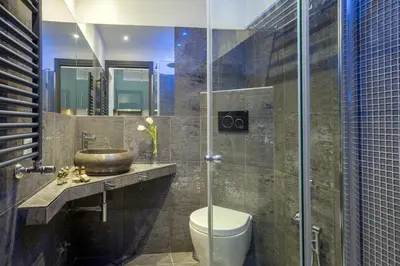 a bathroom with a toilet and a sink and a shower at GCF Luxury Suites, Guest house in Rome