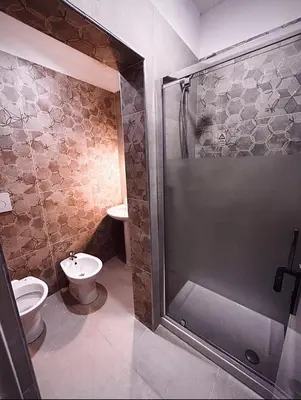 a bathroom with a shower and a toilet at Melting Pot Rome in Rome