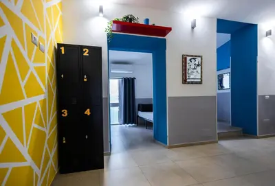 a hallway with a blue and yellow wall at Melting Pot Rome in Rome