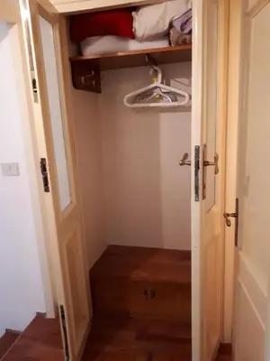 a small closet with a door open and a drawer at Marina in Rome