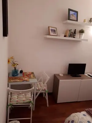 a room with a desk with a computer and a chair at Marina in Rome