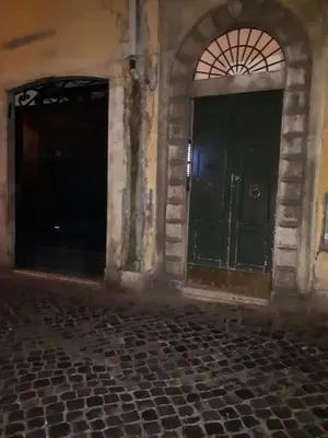 an empty room with two doors and a stone floor at Marina in Rome