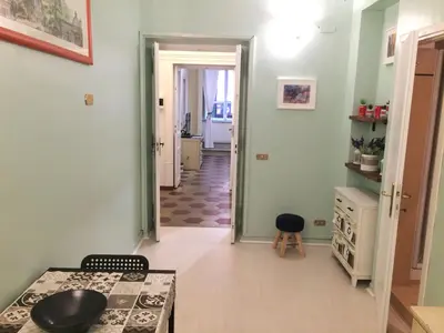 a room with green walls and a hallway at Appart. delizioso nel centro di Roma Vaticano in Rome