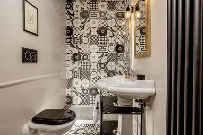 a bathroom with a white sink and a toilet at Borgo Pio Charme in Rome