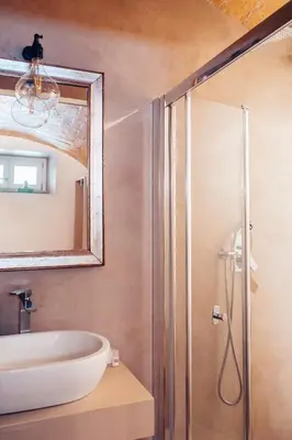 a bathroom with a sink and a mirror at Restart Accommodations Rosa in Rome