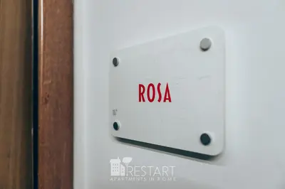 a white switch with the word rosa on it at Restart Accommodations Rosa in Rome
