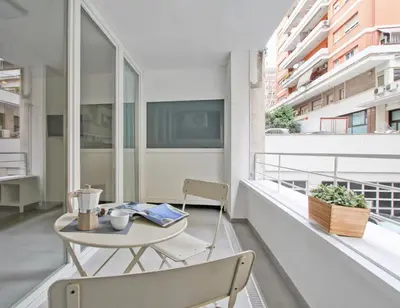a balcony with a table and chairs on a building at Vatican Loft - Rooms & Apartments in Rome