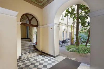 an entrance to a house with a checkered floor at Suite Horti Sallustiani in Rome